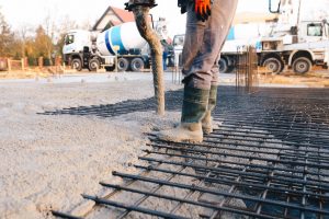 Concrete worker laying a foundation for a business in Lakeland